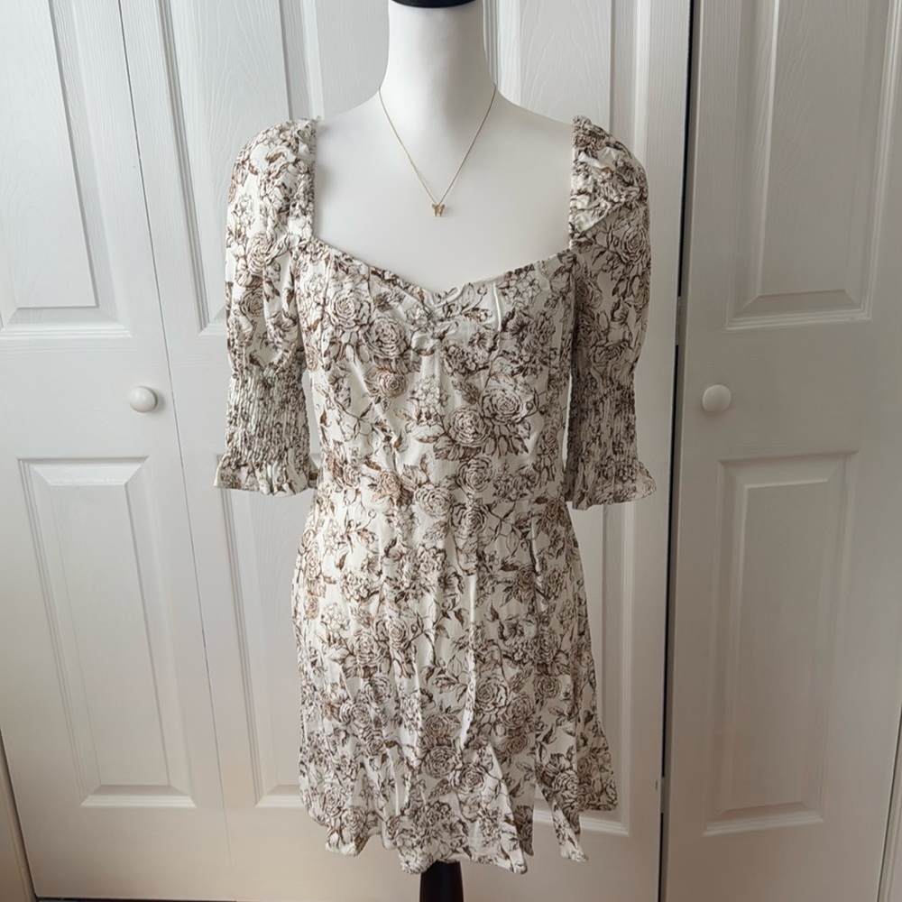 Brown and white floral dress with cinched sleeves